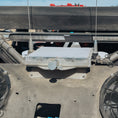 Load image into Gallery viewer, Compact metal Starlink Mini mount attached to a vehicle with visible antennas and cables.
