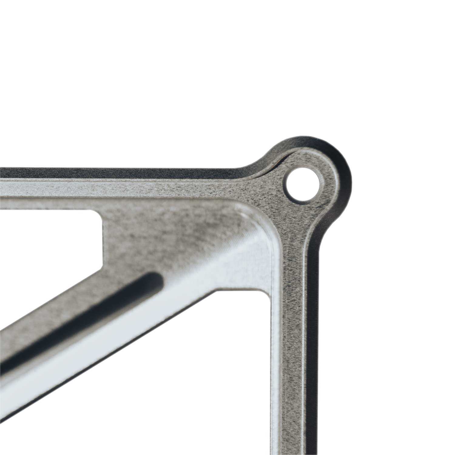 Close-up of silver metal bracket with rounded corner and mounting hole for Starlink Mini Mount.
