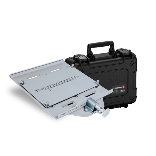 Silver metal mounting plate with black carrying case featuring handle and secure latches.