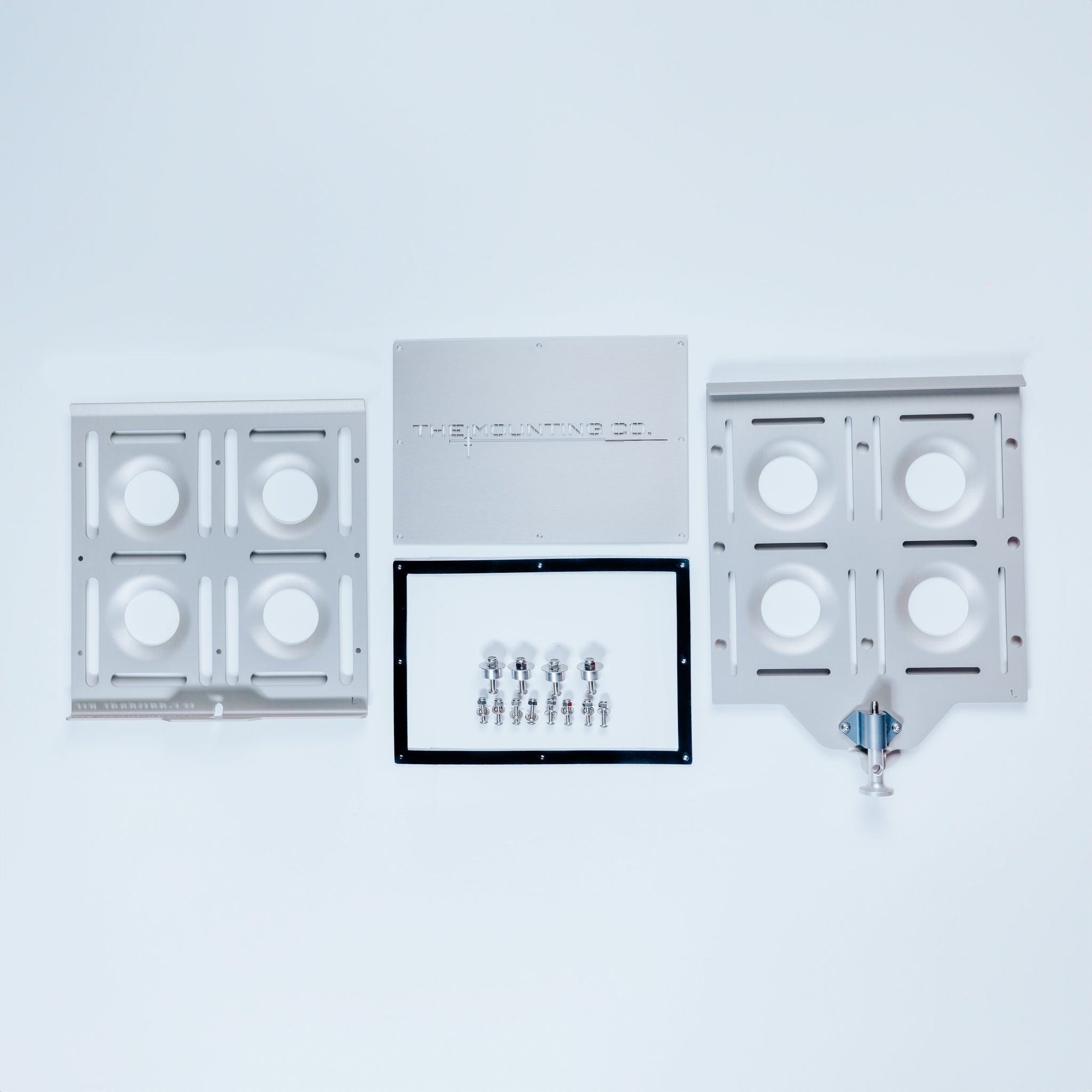 Large silver aluminum mounting plates with circular cutouts, included screws, and a small blue quick-release component on a.