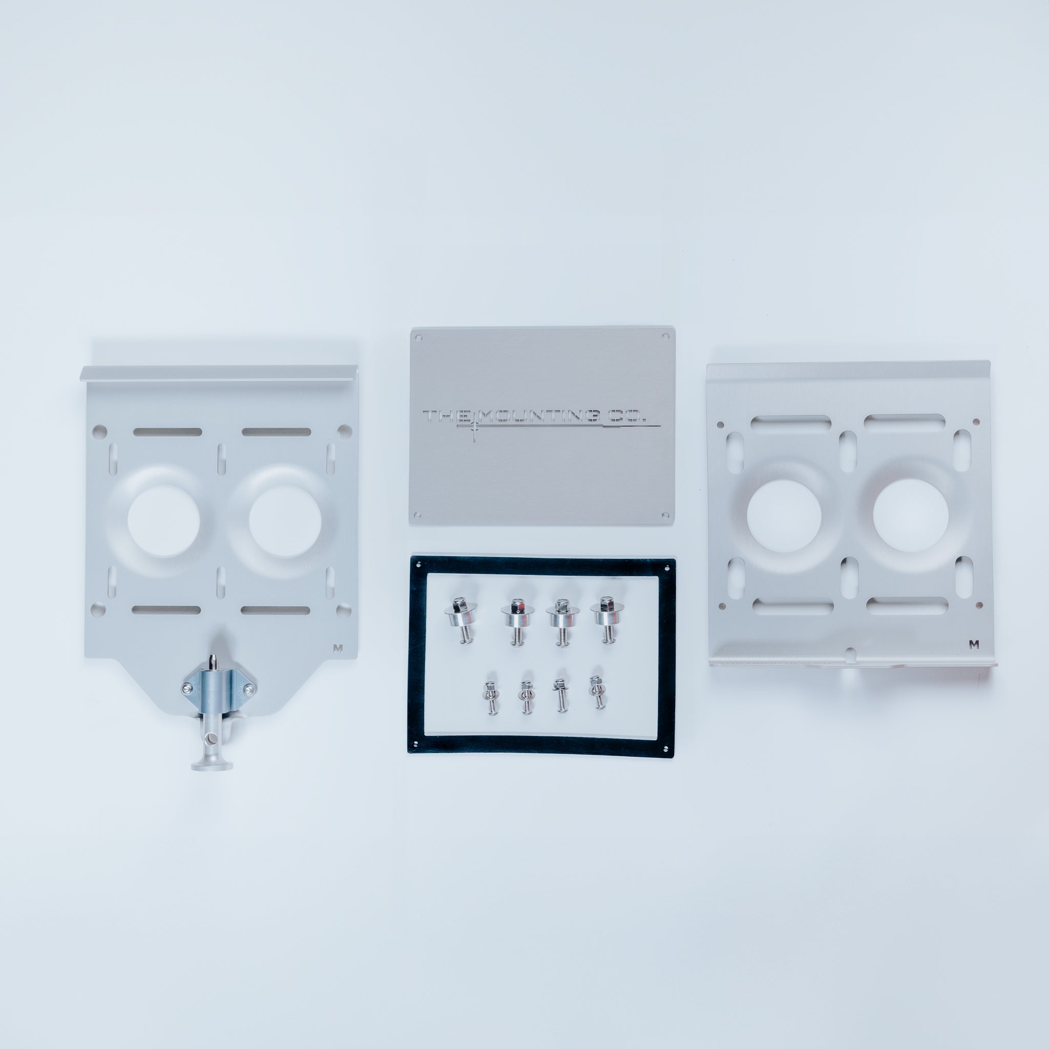 Aluminum medium mount kit with two mounting plates, central bracket, and set of screws on white background.