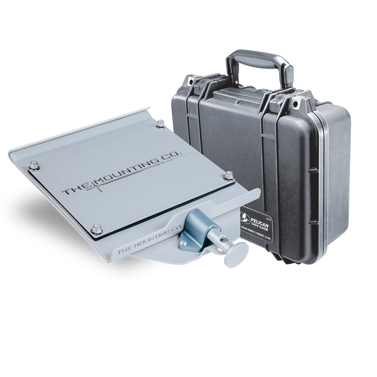 Gray metal medium mount plate with a small locking mechanism next to a closed black Pelican Protector 1400 hard case with.
