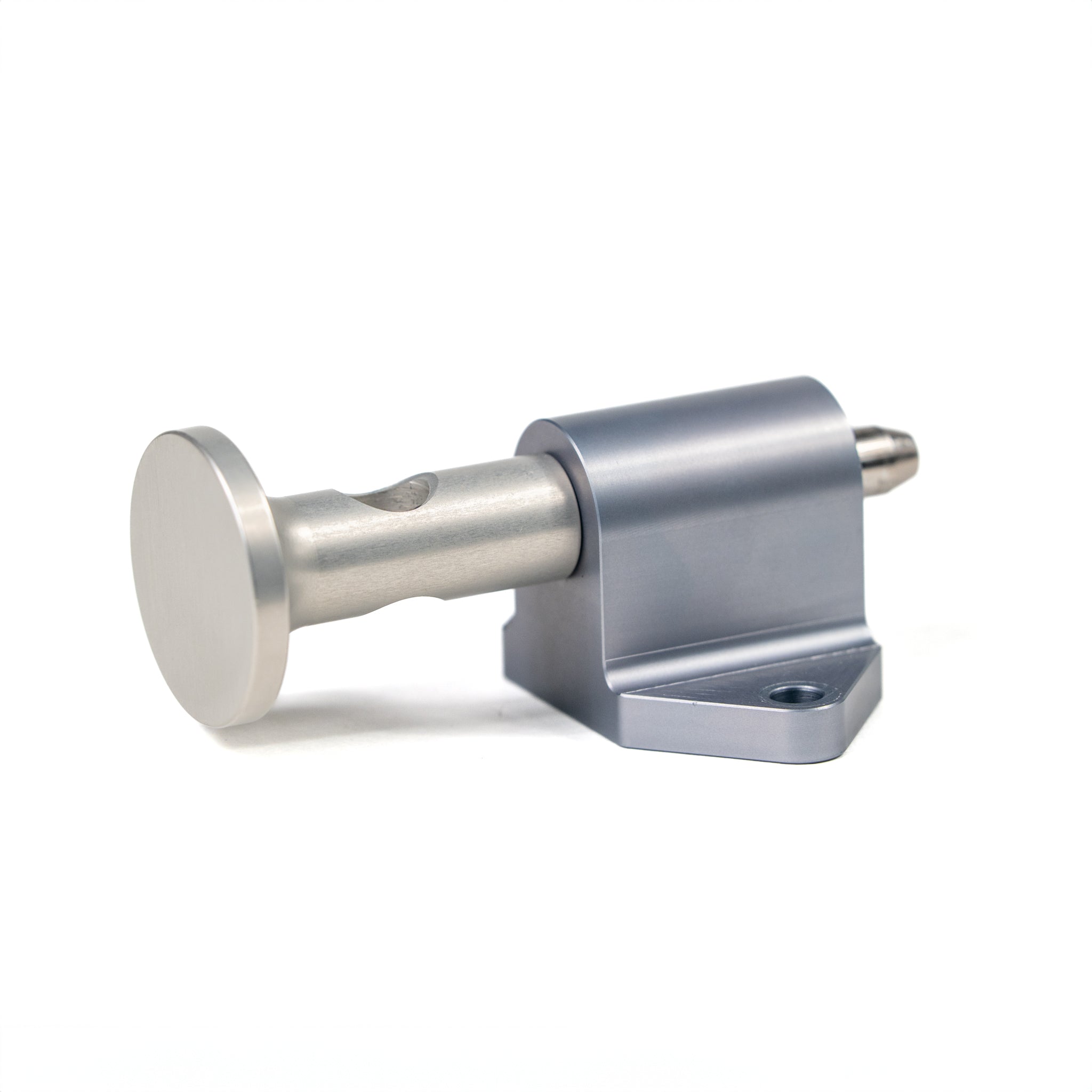 Silver metal pin with flat head attached to gray mounting block with two screw holes on white background.