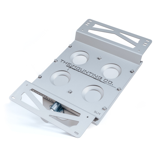 Silver aluminum TMC Starlink mount with multiple circular cutouts and quick-release design.