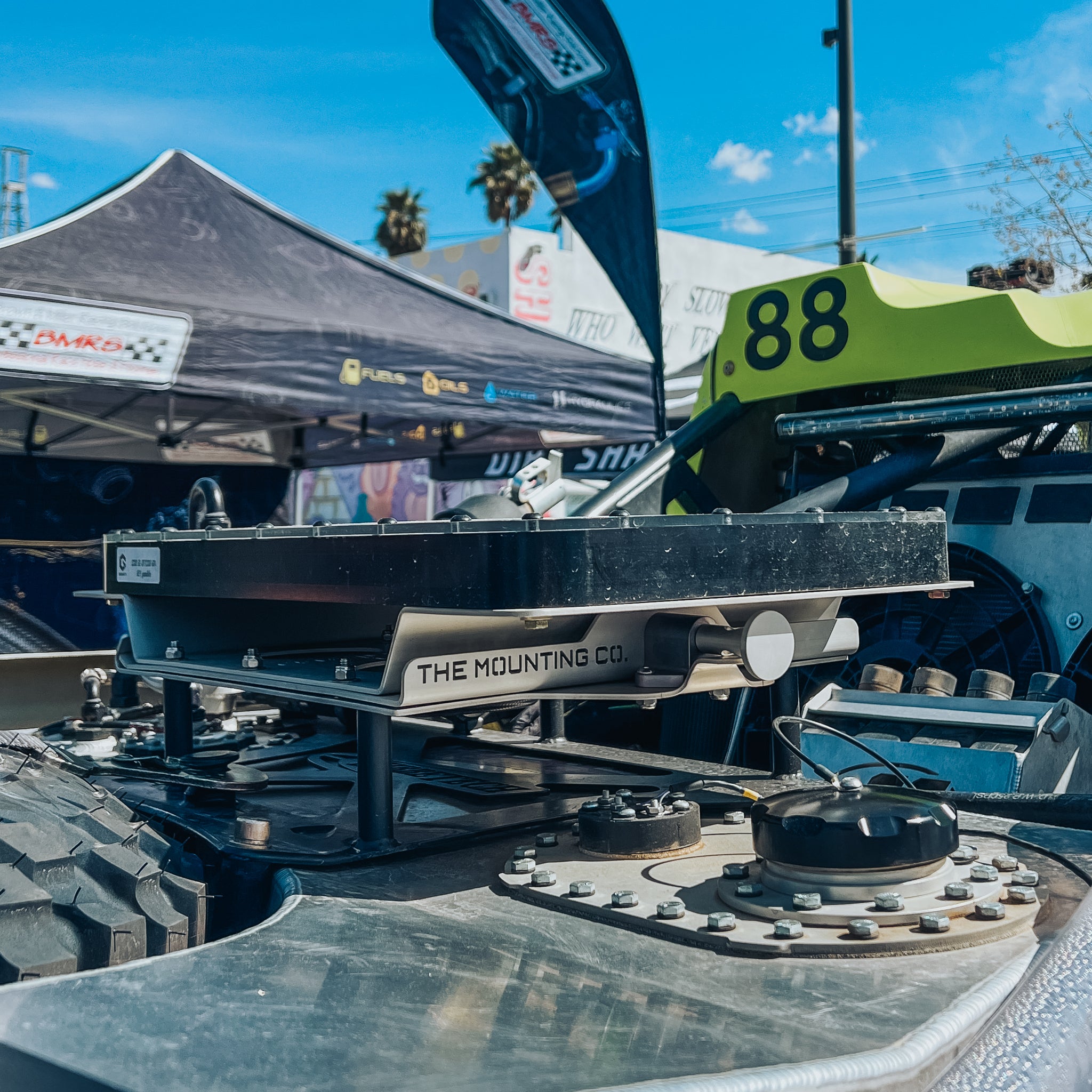 Black aluminum TMC Starlink quick-release mount attached to rugged off-road vehicle roof rack.