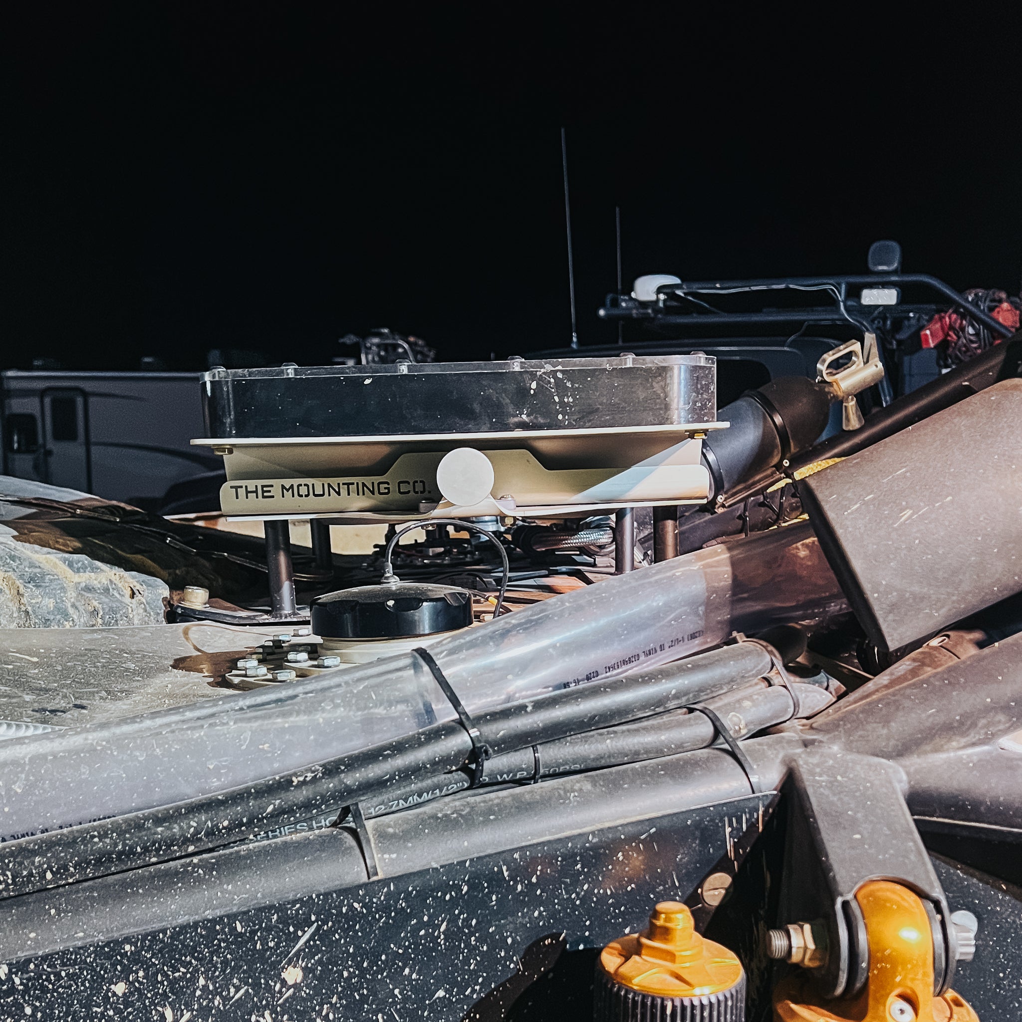 Aluminum TMC Starlink mount attached to rugged offroad vehicle frame with quick-release feature.