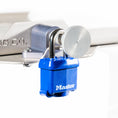 Load image into Gallery viewer, Blue Master padlock secured to silver metallic TMC Starlink Mount bracket with quick-release pin mechanism.

