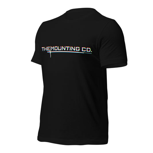 Black t-shirt with white glitch-style "THE MOUNTING CO." logo across the chest.
