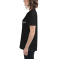 Load image into Gallery viewer, Black relaxed-fit women's t-shirt with short sleeves and crew neck, side profile view.
