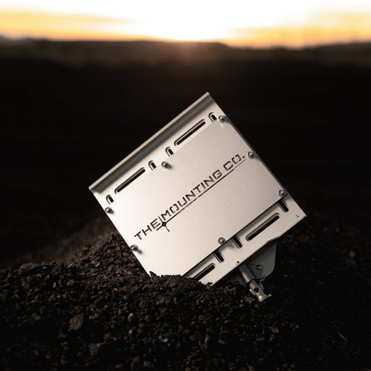 Silver aluminum large universal mount plate with quick-release slots and THEMOUNTINGCO logo.